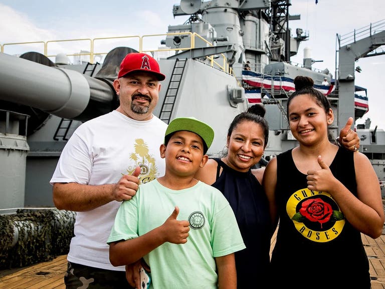 A family tours the Battleship IOWA in San Pedro