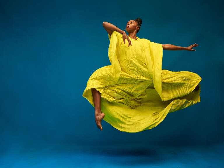 Dancer in yellow outfit.