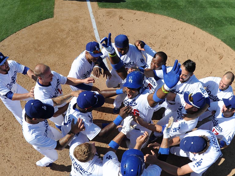 The Dodgers celebrate Yasiel Puig's walk-off home run at Dodger Stadium in 2013