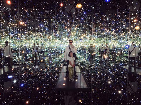 Dr. Woo and his son inside Yayoi Kusama's "Infinity Mirrored Room" at The Broad