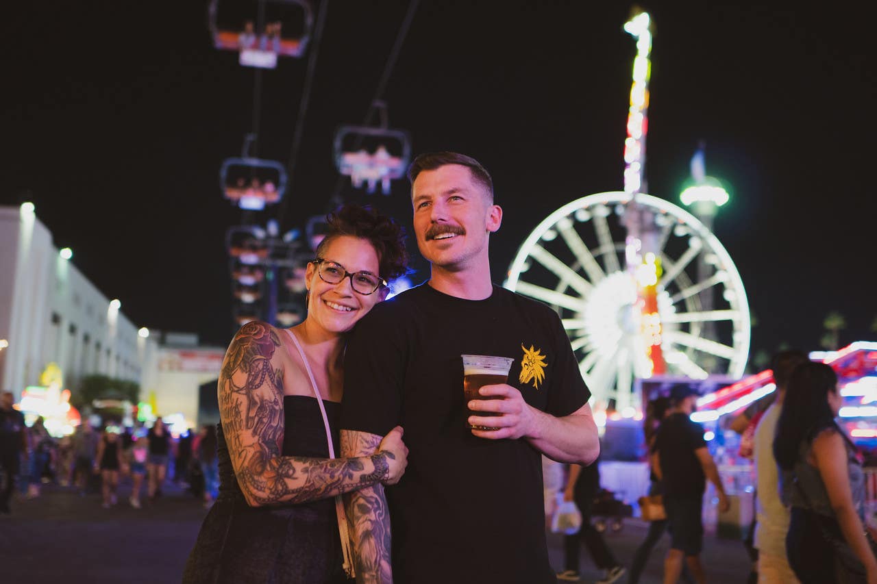 Couple in the Fun Zone at the LA County Fair at night