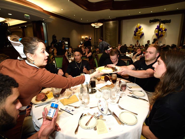 Washington Huskies dining at the Lawry's Beef Bowl in December 2018