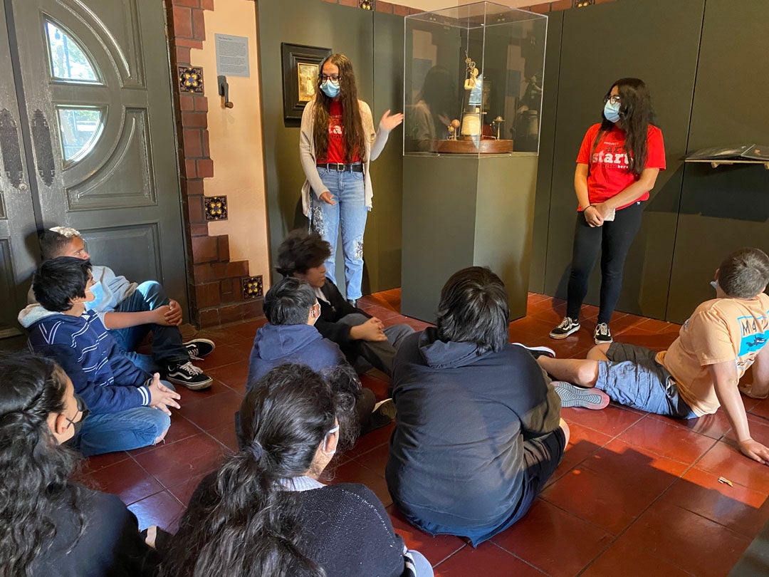 Oakmont Elementary students on a visit to the exhibition, "John Frame: Mephistopheles and the Swan Girl"