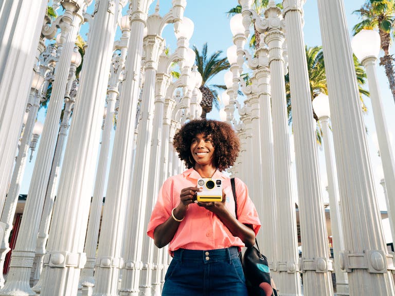 Actor from campaign photographed in street light installation outside LACMA