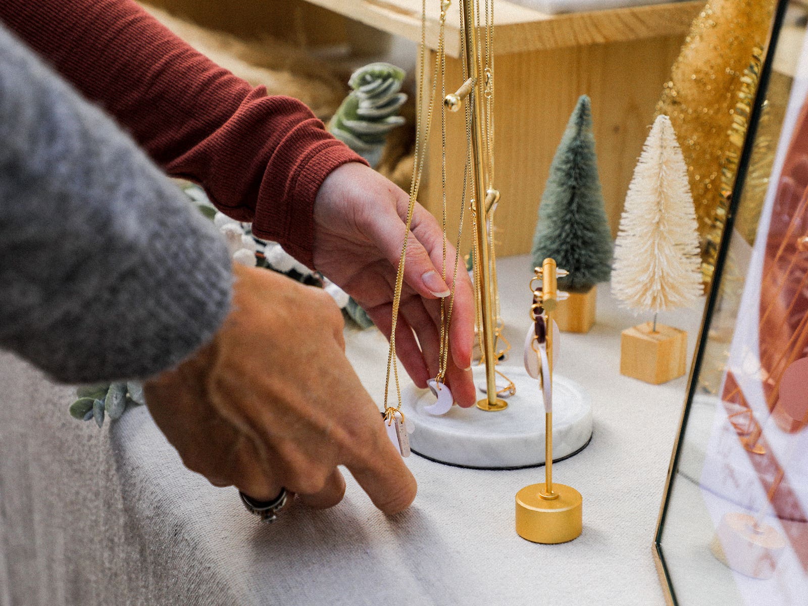 Shoppers examine jewelry at the FIDM Holiday Market