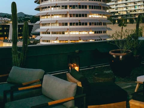 The Aster's outdoor patio overlooks the historic Capitol Records building in Hollywood.
