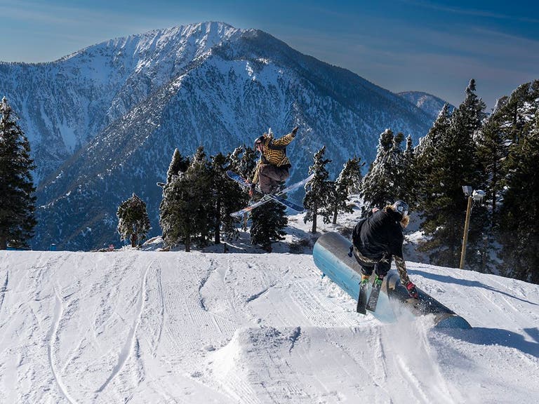 Skiers catching air at Mountain High