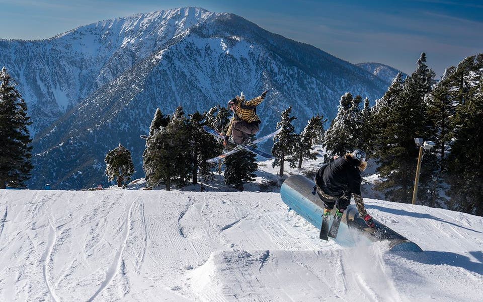 Skiers catching air at Mountain High