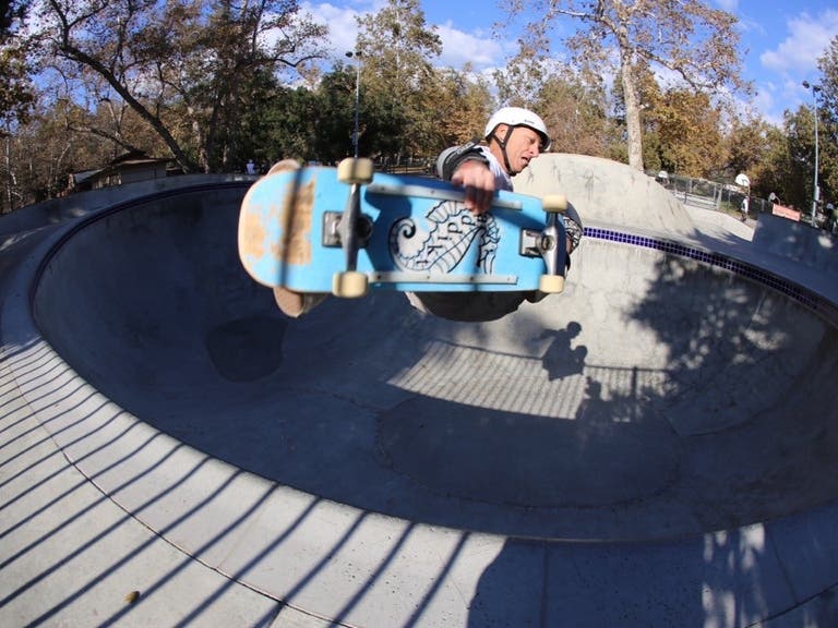 A skateboarder catches air at Verdugo Skate Park