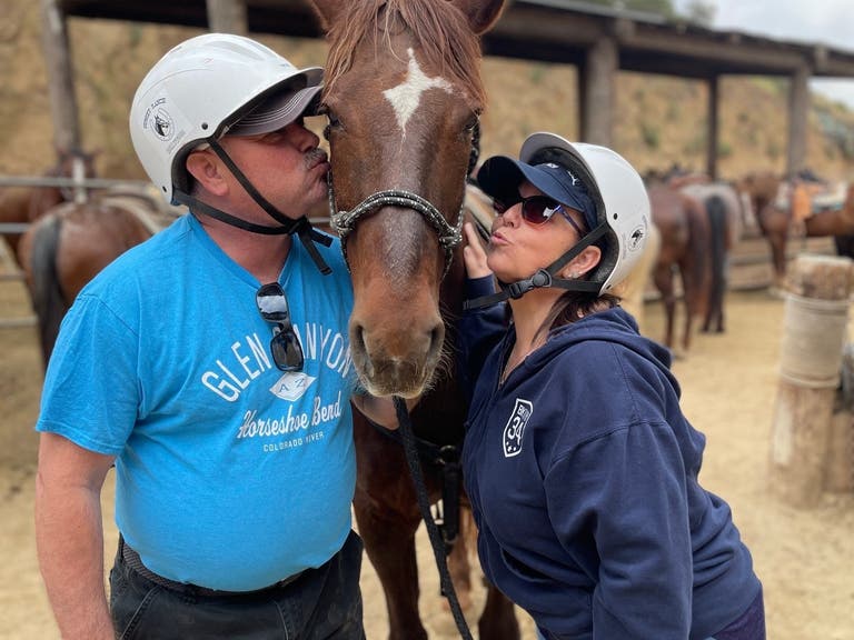 Couple kisses a horse at Sunset Ranch Hollywood