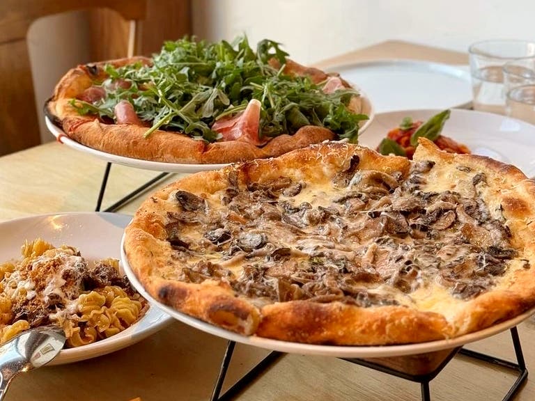 Mixed Mushroom and Burrata + Prosciutto di Parma pizzas at Milo & Olive