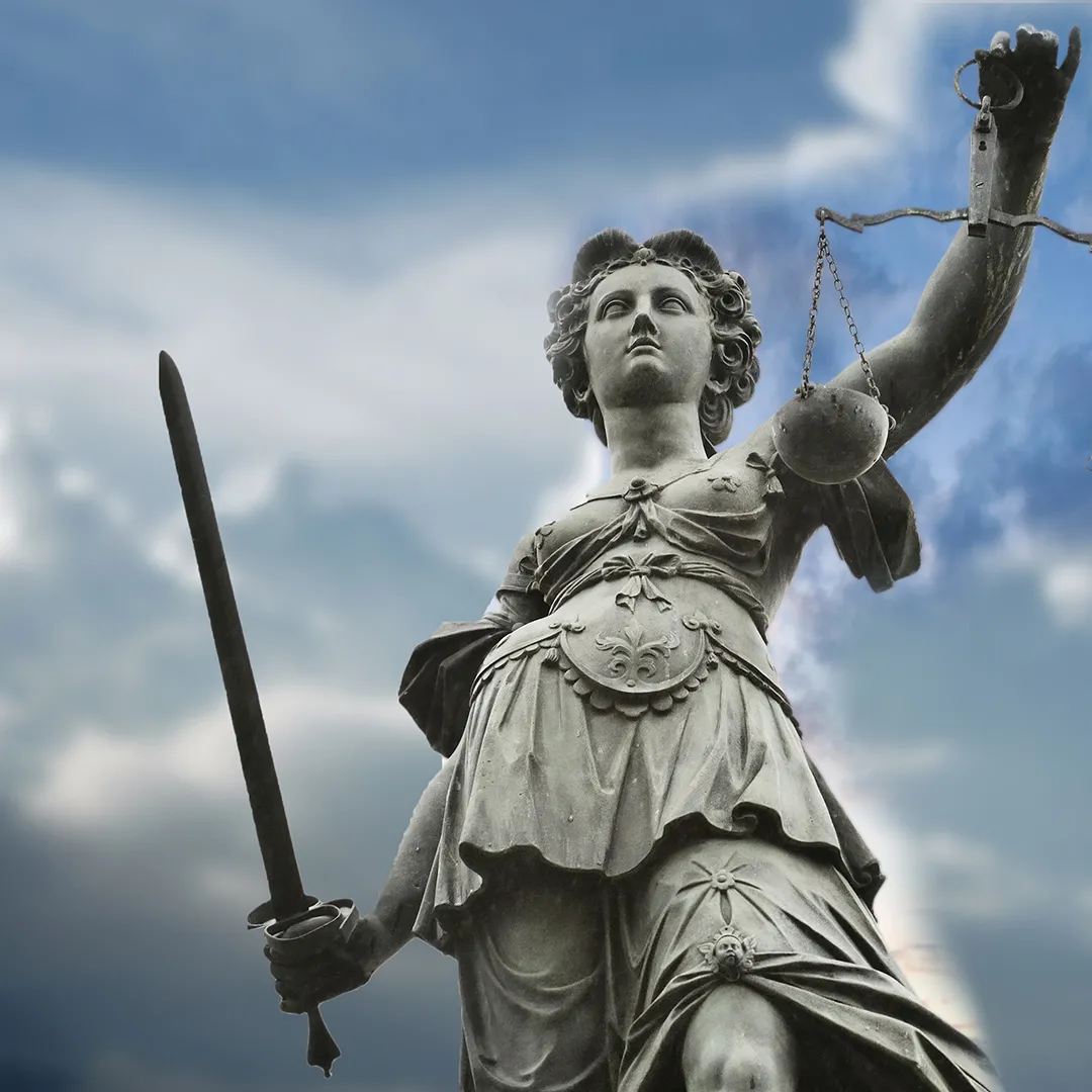Statue of Justice holding scales and a sword