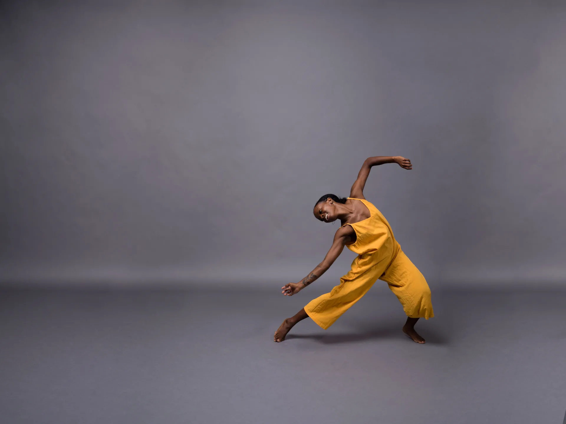Dancer in yellow outfit.