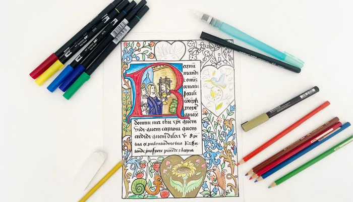 Manuscript coloring page surrounded by art tools