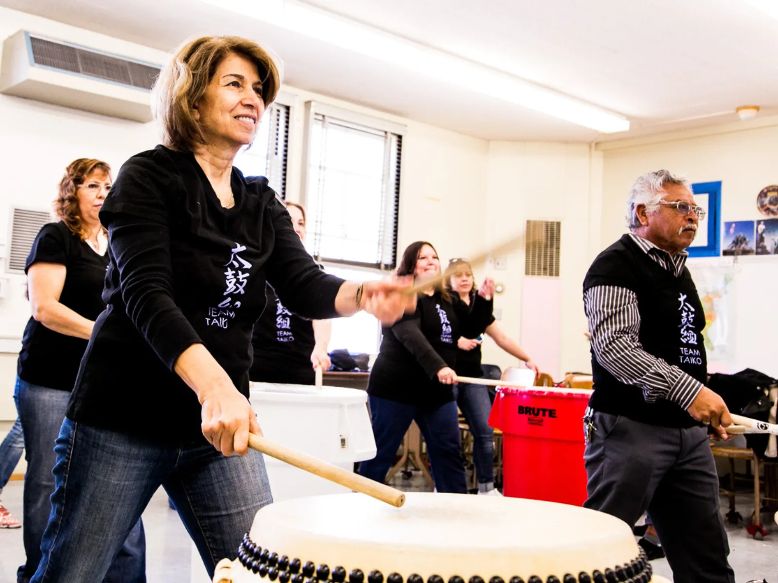 A woman hits a taiko drum