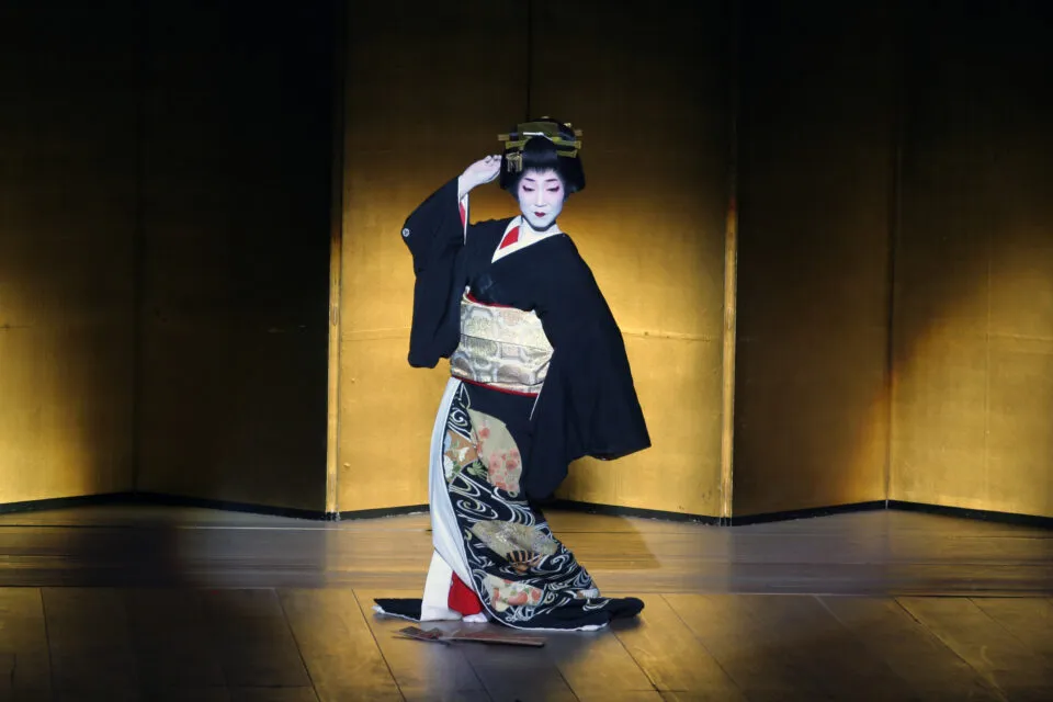 A woman in traditional Japanese dance attire.