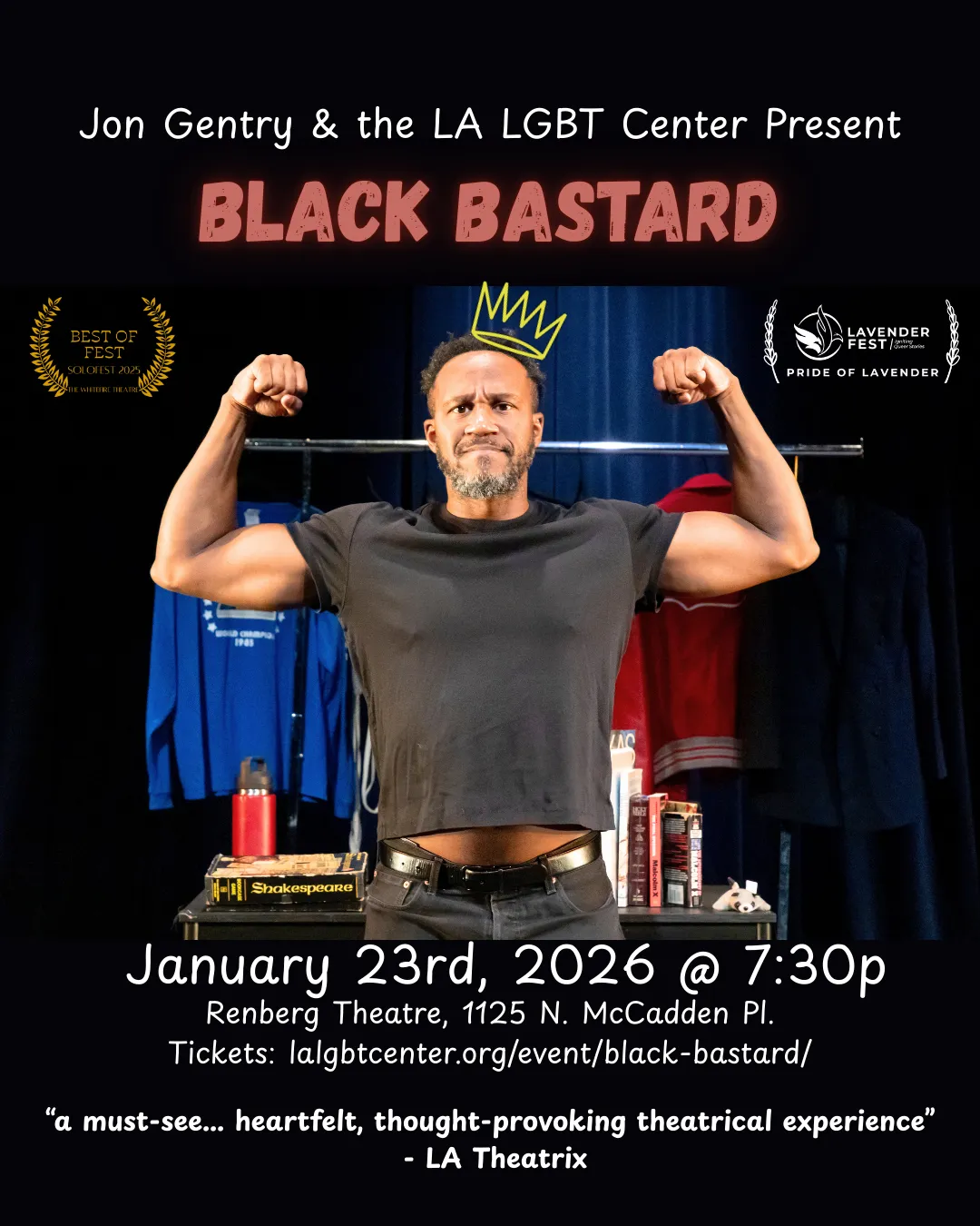 Jon flexing arm muscles in front of books and wardrobe