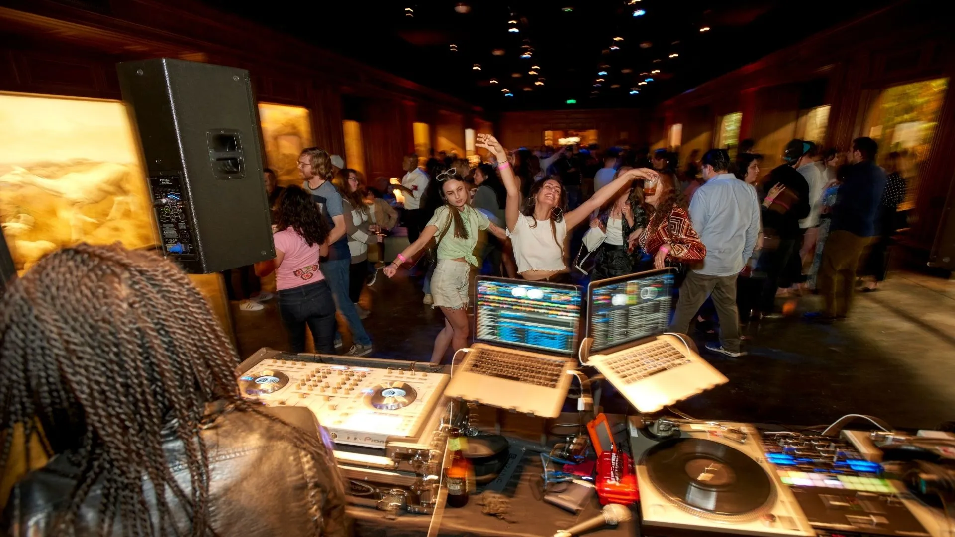 Guests enjoying live music in NHMLA's African Mammal Hall for First Fridays